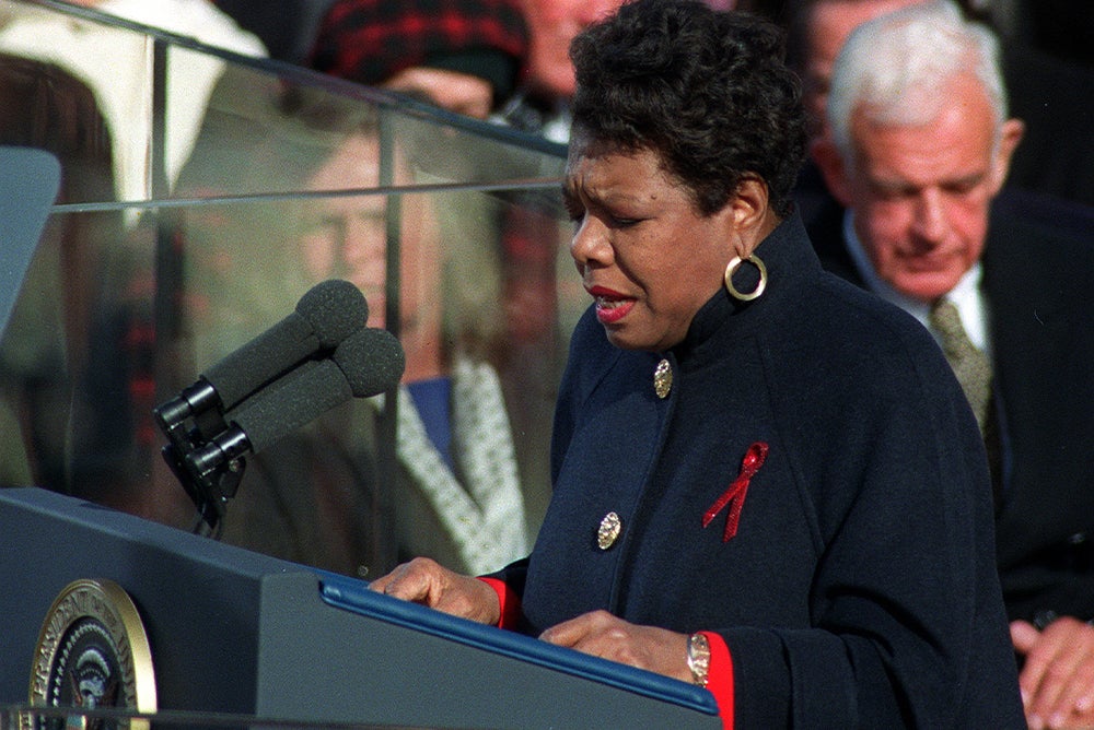 Maya Angelou recites her poem "On the Pulse of the Morning," written for the inaugural, during the presidential inauguration on Capitol Hill in Washington, D.C., Jan. 20, 1993. She wears a black coat and is looking down at the podium.